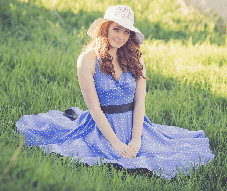Screenshot_2019-04-12 Portrait of a Smiling Young Woman in Grass · Free Stock Photo