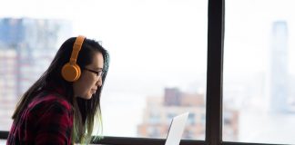 Photography of Woman Using Laptop