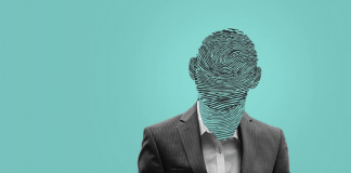 A person wearing a suit and tie Description automatically generated