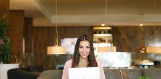 Shallow Focus Photo of Woman Sitting on Couch