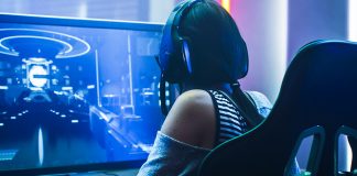 A picture containing person, indoor, front, monitor Description automatically generated