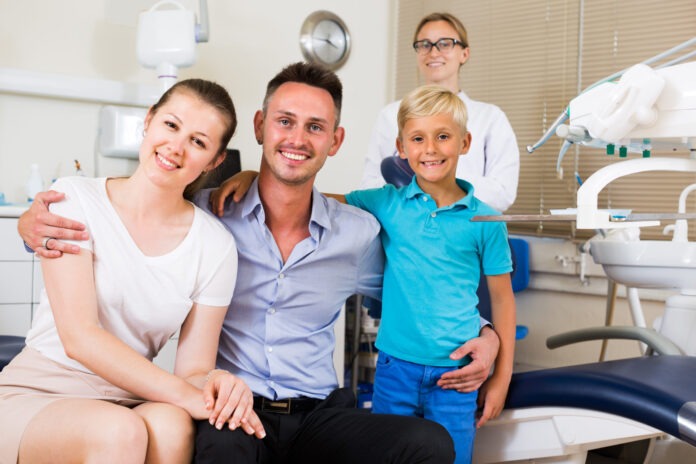 Visitors are on dentist's receptionist