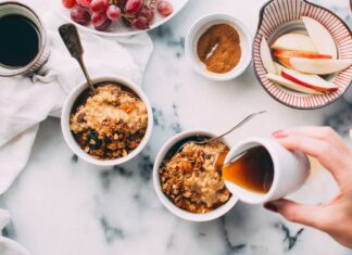 person holding white ceramic cup