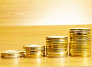 3 Reasons Precious Metals Belong in Your Portfolio 4 rows of coins arranged in ascending order Free Photo