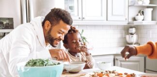 man and woman eating on table