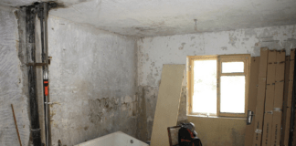 A picture containing indoor, floor, room, old Description automatically generated