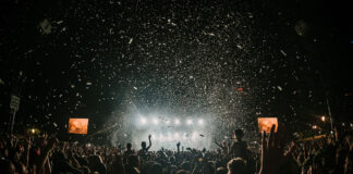 A crowd of people at a concert Description automatically generated with medium confidence
