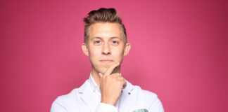 A person in a white coat Description automatically generated with medium confidence
