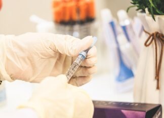 What Does a Cosmetologist Do? person holding white and black pen