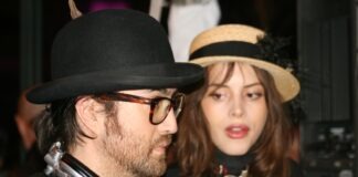 man in black shirt beside woman in black shirt