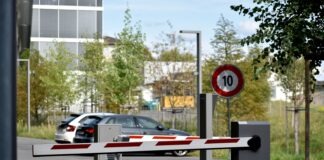 white and red sedan on road during daytime