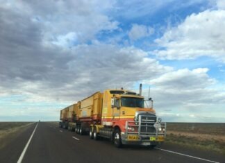 10 Advantages of Outsourcing Fleet Management truck on highway during daytime