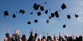 A group of people throwing their hands up in the air Description automatically generated with low confidence