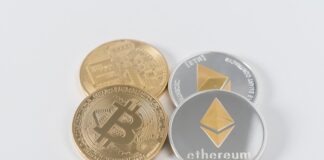 four round silver-colored and gold-colored Bitcoins