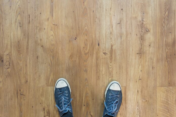 Photo by Neven Krcmarek person wearing blue-and-white low-top sneakers