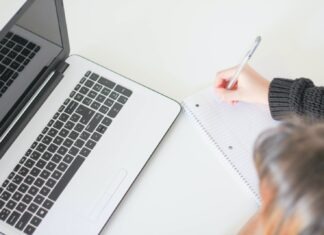 5 Benefits of Taking Online Classes woman writing on notebook
