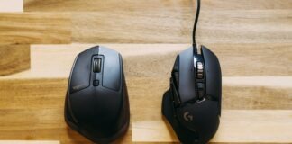 black corded computer mouse on brown wooden table