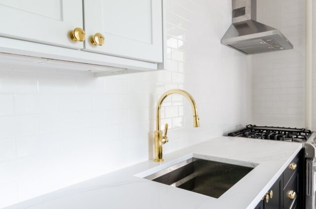 Photo by Chastity Cortijo white wooden door beside stainless steel sink