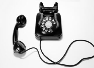 How to achieve Corporate Competitiveness with Virtual Phone Numbers black rotary dial phone on white surface