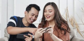 man and woman siting on sofa chair inside room