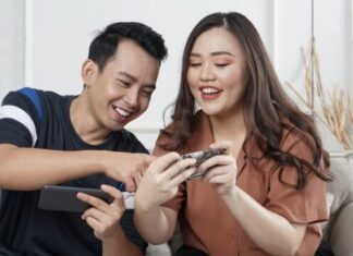 Why Gaming is a Great Way to Connect with Friends and Family man and woman siting on sofa chair inside room