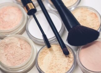What Is the Role of Foundation in Make-up and What Should You Know About It? three makeup brushes on top of compact powders