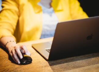 Benefits of Hiring an SEO Agency Instead of Doing It Yourself  person in yellow dress shirt using black laptop computer