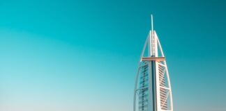 white metal bridge under blue sky during daytime
