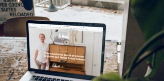 MacBook Pro on top of brown wooden table during daytime