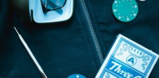 poker chip beside playing card box