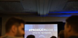 people in conference with projector screen in front