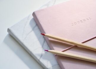 5 Things to Consider When Choosing a Technique for Writing Essays red and purple coloring pencils on pink journal