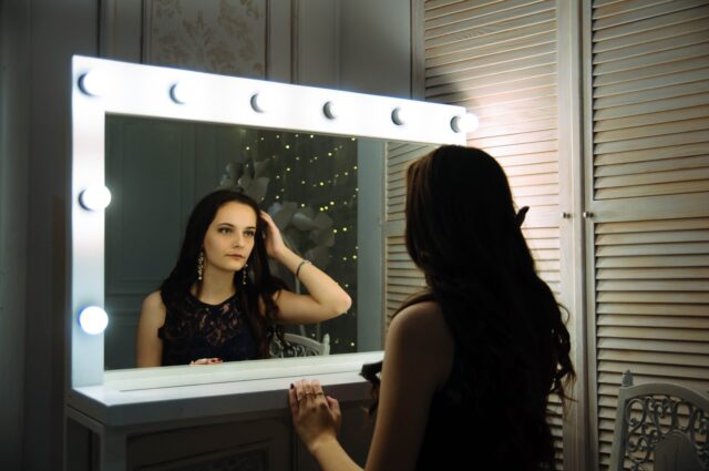 Photo by Oleg Sergeichik woman wearing black sleeveless top