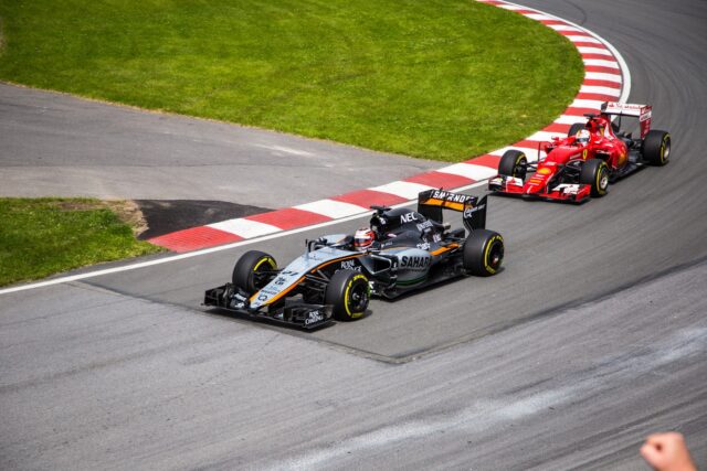 Photo by Jp Valery black and red racing car during daytime