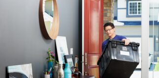 man in blue polo shirt sitting on chair