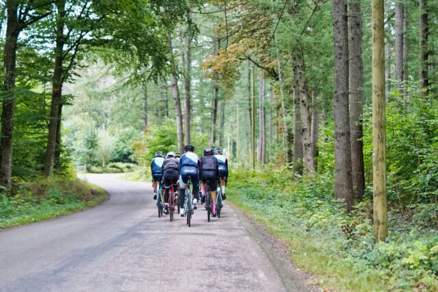 Photo by Martin Magnemyr people riding bicycles on road during daytime