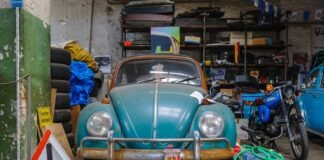 blue volkswagen beetle parked on parking lot