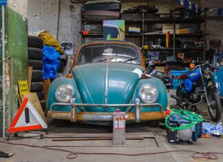 blue volkswagen beetle parked on parking lot