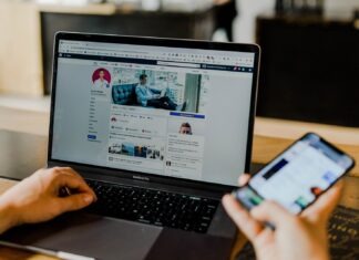 Digital nomad: An impractical dream or the future of work? person using both laptop and smartphone