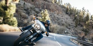 man riding motorcycle at the road during daytime