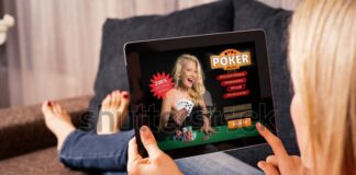 Woman playing poker on tablet