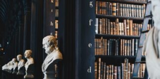 book lot on black wooden shelf