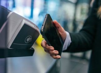 How Does FinTech Make Banking Easy? woman holding Android smartphone