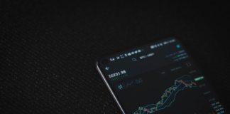 black android smartphone on black textile