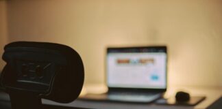 black flat screen computer monitor on black desk