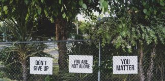don't give up. You are not alone, you matter signage on metal fence
