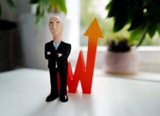 How Can Bitcoin Affect Fiserv and Other Payment Stocks? man in black suit jacket and black pants figurine