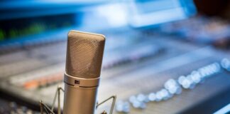 silver microphone near audio mixer