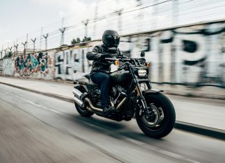The Best US Motorbikes for those Looking for a New Bike person riding motorcycle on concrete road