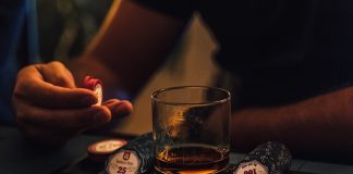 person holding clear drinking glass